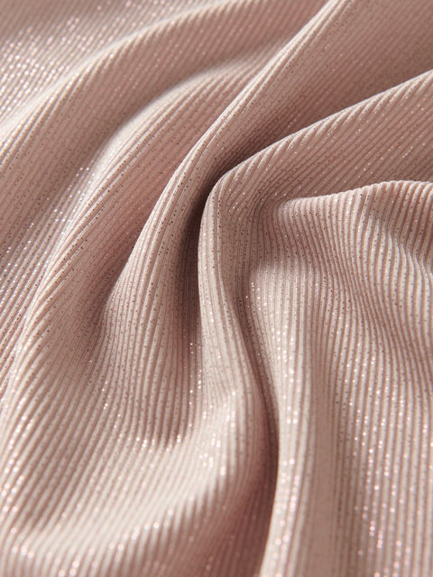 Close-up of pink textured fabric with folds