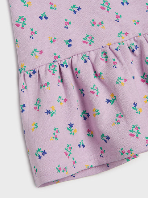 Purple fabric with colorful floral pattern on a white background