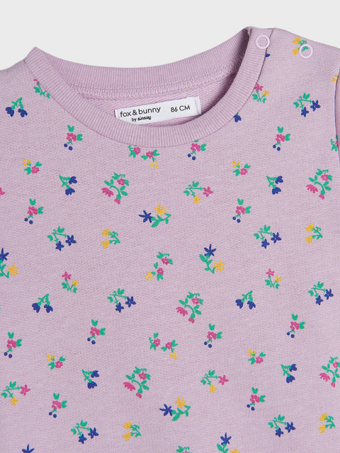 Purple garment with colorful floral pattern and 'fox & bunny' label.
