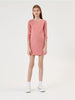 Person wearing a pink dress on a white background