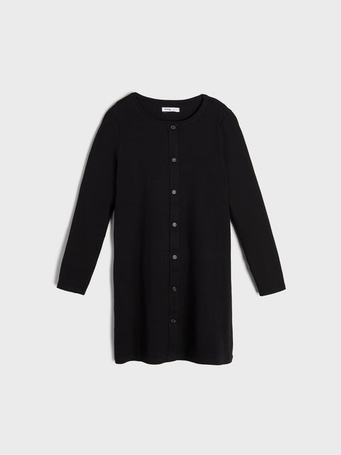 Black dress with buttons on a light gray background