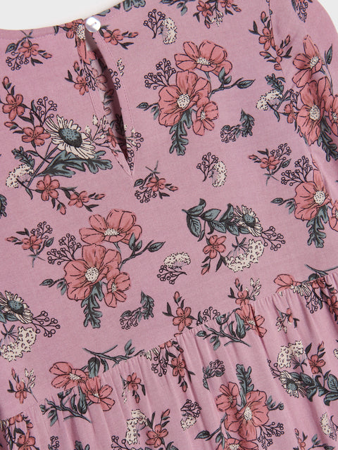 Floral patterned fabric with pink flowers on a pink background