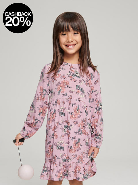 Young girl wearing a pink floral dress on a gray background with a cashback 20% badge.