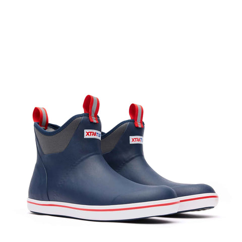 Pair of blue rain boots with red accents on a white background