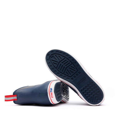 Navy rubber boots with red and white accents on a white background