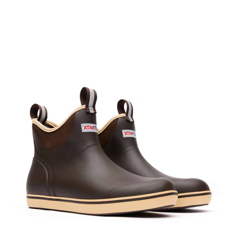 Pair of brown rain boots with beige soles on a white background