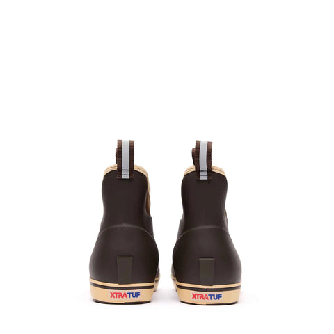 Pair of Xtratuf rubber boots on a white background