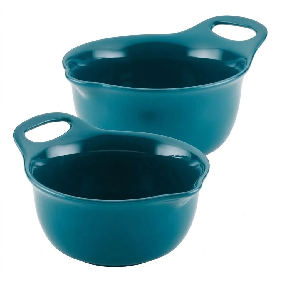 Two teal ceramic saucepans with loop handles, shown on a plain white background.
