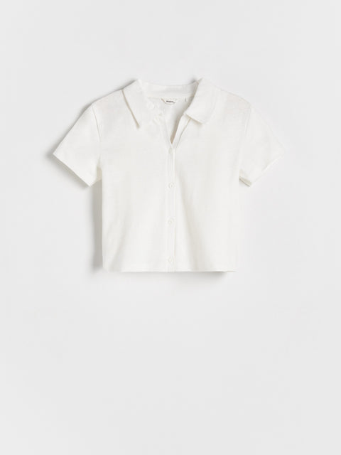 White blouse on a light gray background