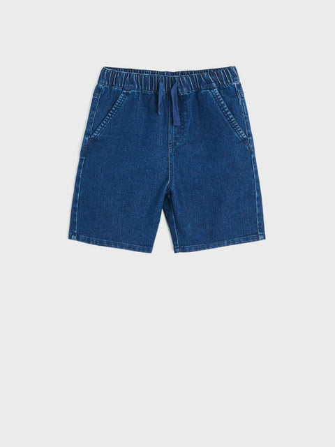 Blue denim shorts on a white background