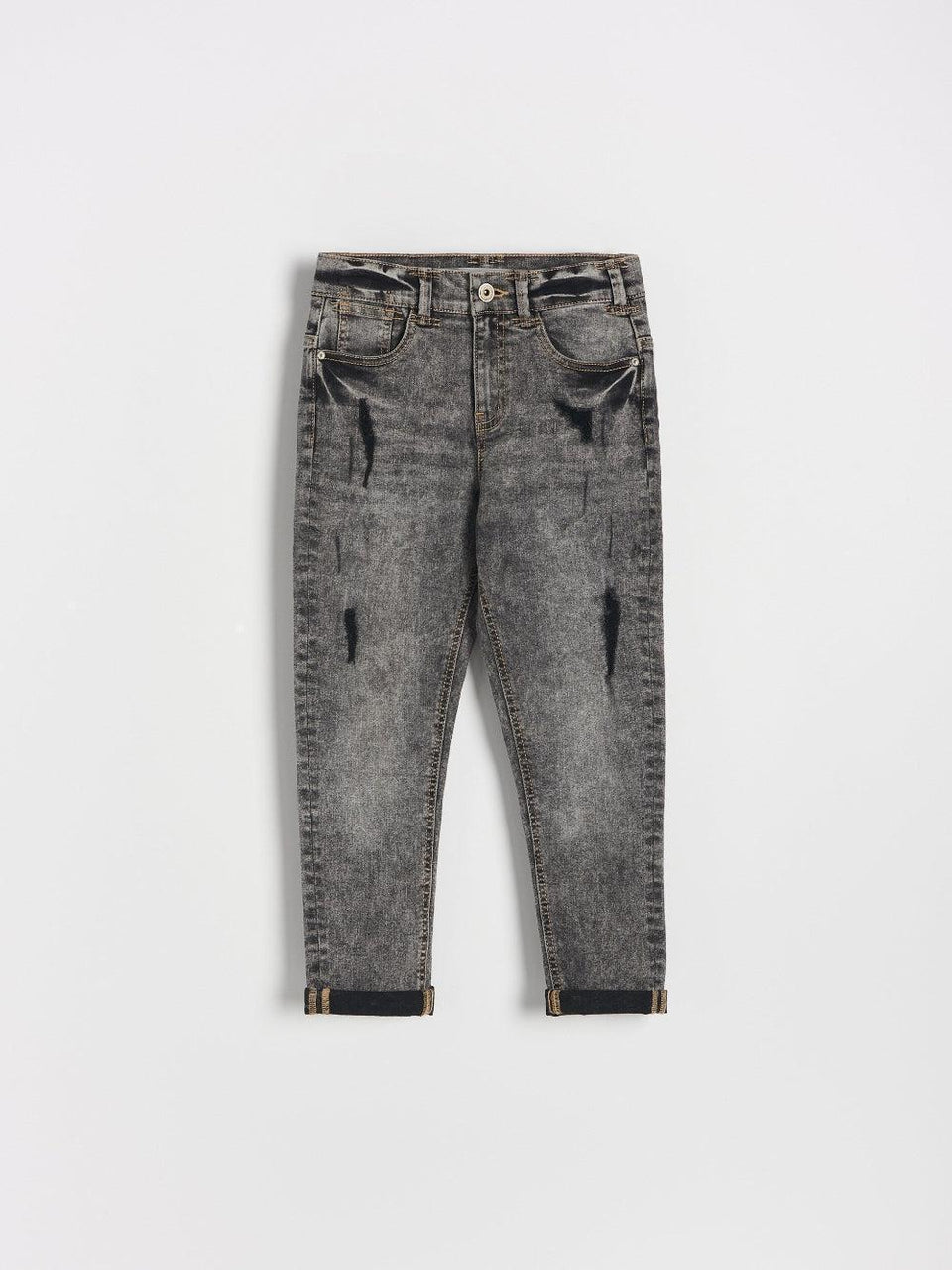 Gray distressed jeans on a white background