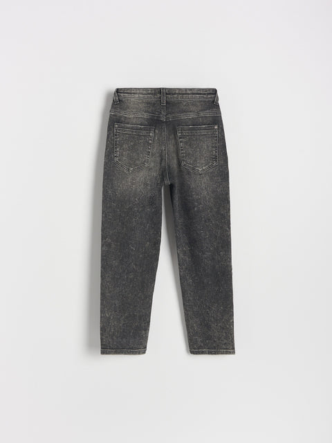 Black jeans on a light gray background