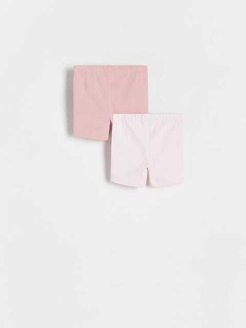 Two pink fabric swatches on a light gray background