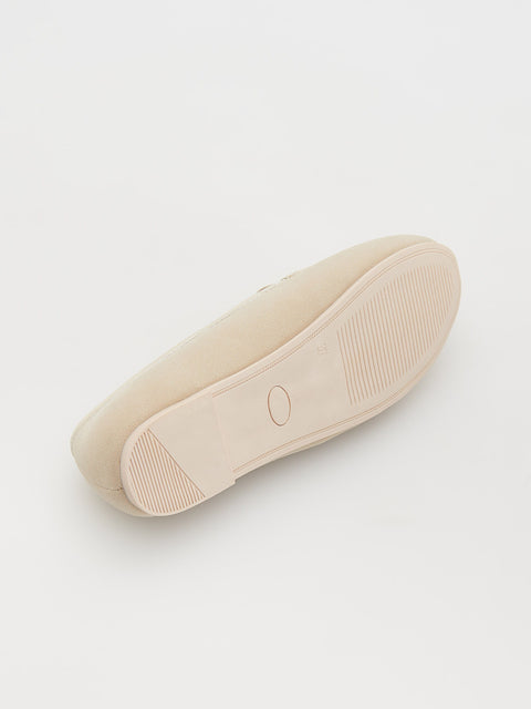 Beige shoe sole on a light gray background