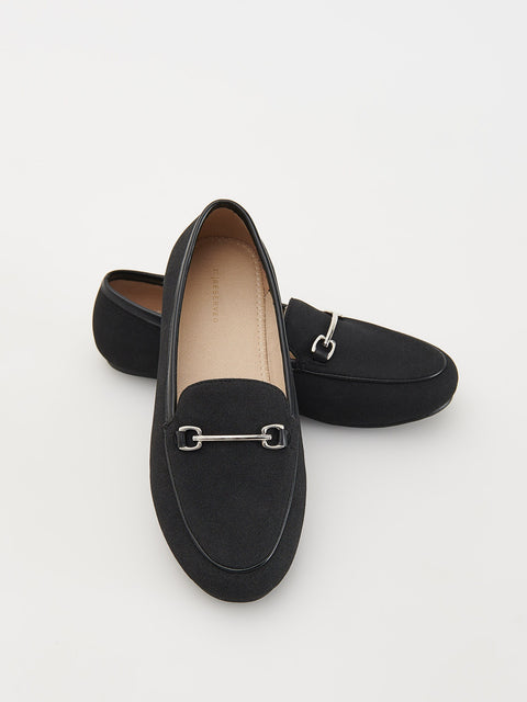 Black loafers with a silver buckle on a white background
