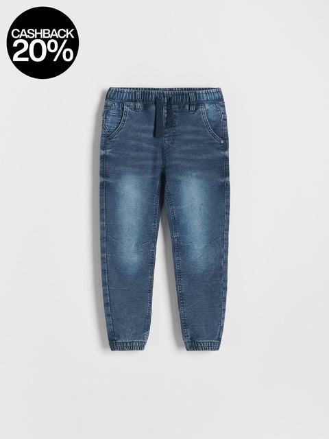 Blue jeans on a light gray background