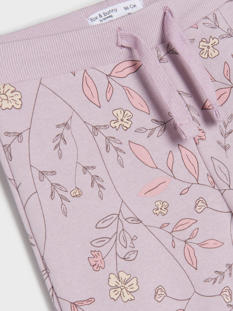 Floral patterned fabric with a brand label on a white background