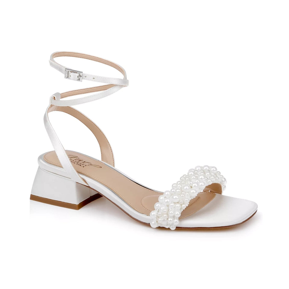 A white satin sandal with an ankle strap, a low block heel, and a decorative strap embellished with white faux pearls, shown on a plain white background.