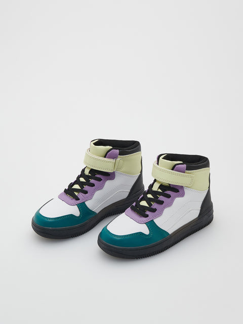 Colorful high-top sneakers on a light gray background