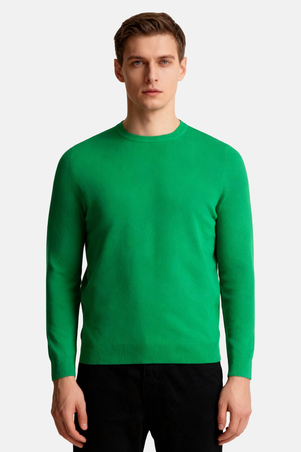 Man wearing a green sweater on a white background