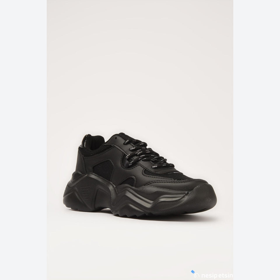 Brown suede shoe on a white background