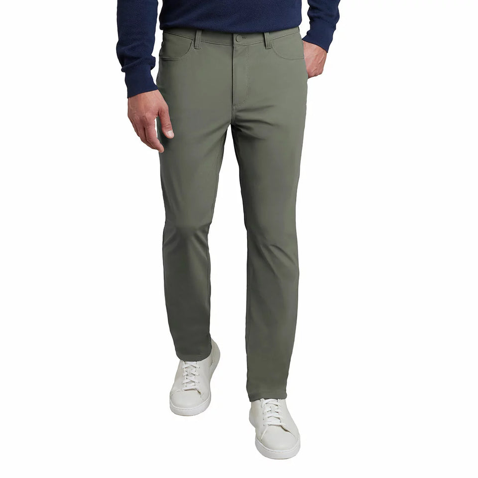 Person wearing olive green pants on a white background