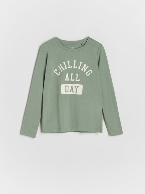 Green long-sleeve shirt with 'Chilling All Day' text on a light gray background