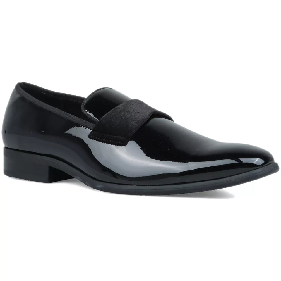 Black patent leather loafer on a white background