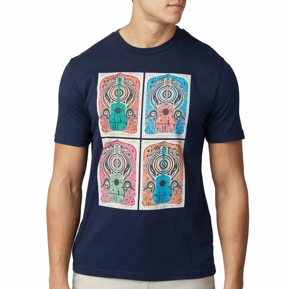A man wearing a navy blue crewneck t-shirt featuring a graphic print of four colorful, symmetrical mandala-like skull designs arranged in a 2x2 grid on the chest.