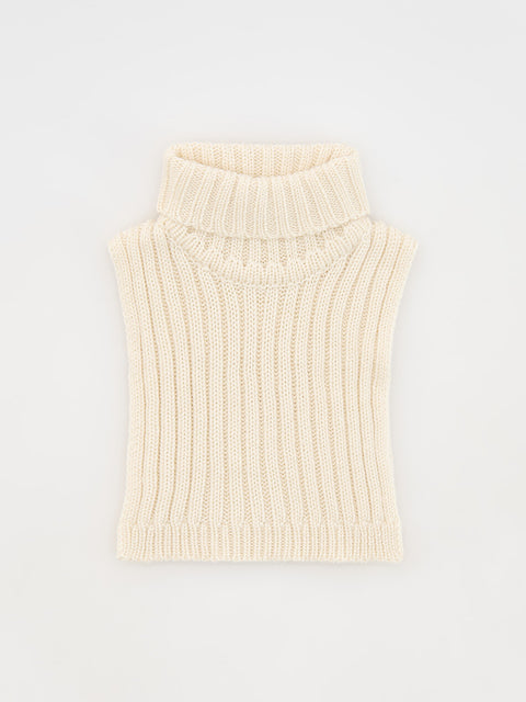 Cream-colored ribbed knit sleeveless sweater on a light gray background