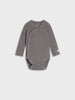 Gray baby bodysuit on a light gray background