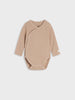 Beige baby bodysuit on a light gray background
