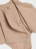 Beige baby romper with button details on a white background