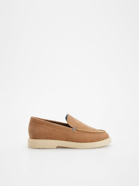 Tan loafer shoe on a white background