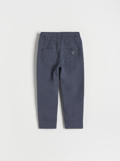 Navy blue pants on a light gray background