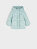 Light blue puffer jacket on a light gray background