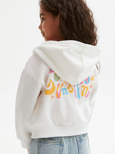Child wearing a white hoodie with colorful text on the back against a white background