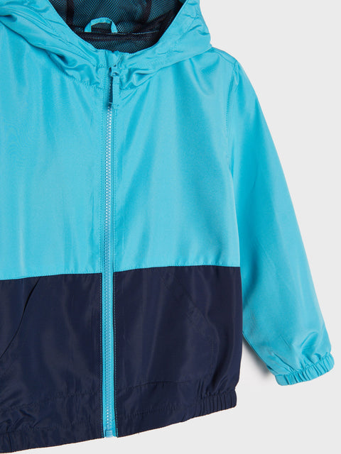Blue and navy raincoat on a light gray background