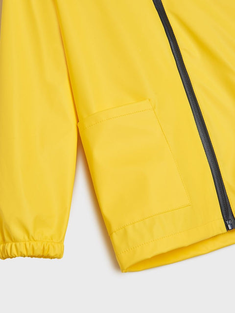 Yellow jacket with a black zipper on a light gray background