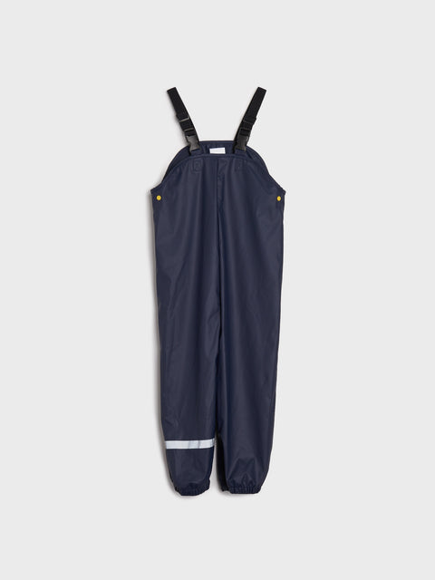 Navy blue rain overalls with black straps on a white background