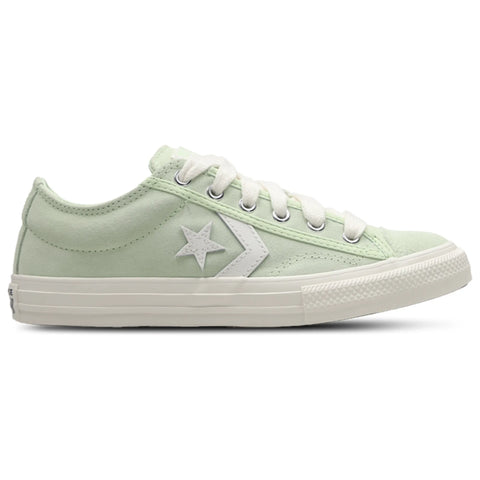 Light green sneaker with white star logo on a white background