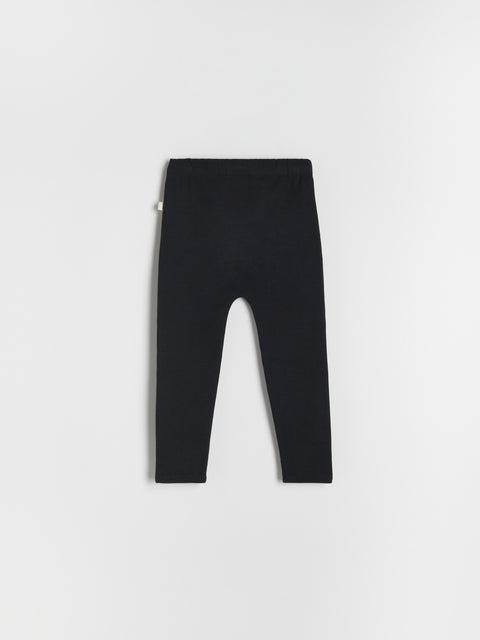 Black leggings on a light gray background
