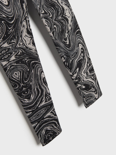 Black and white marbled patterned tie on a light gray background