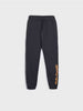 Black sweatpants with yellow text on a white background
