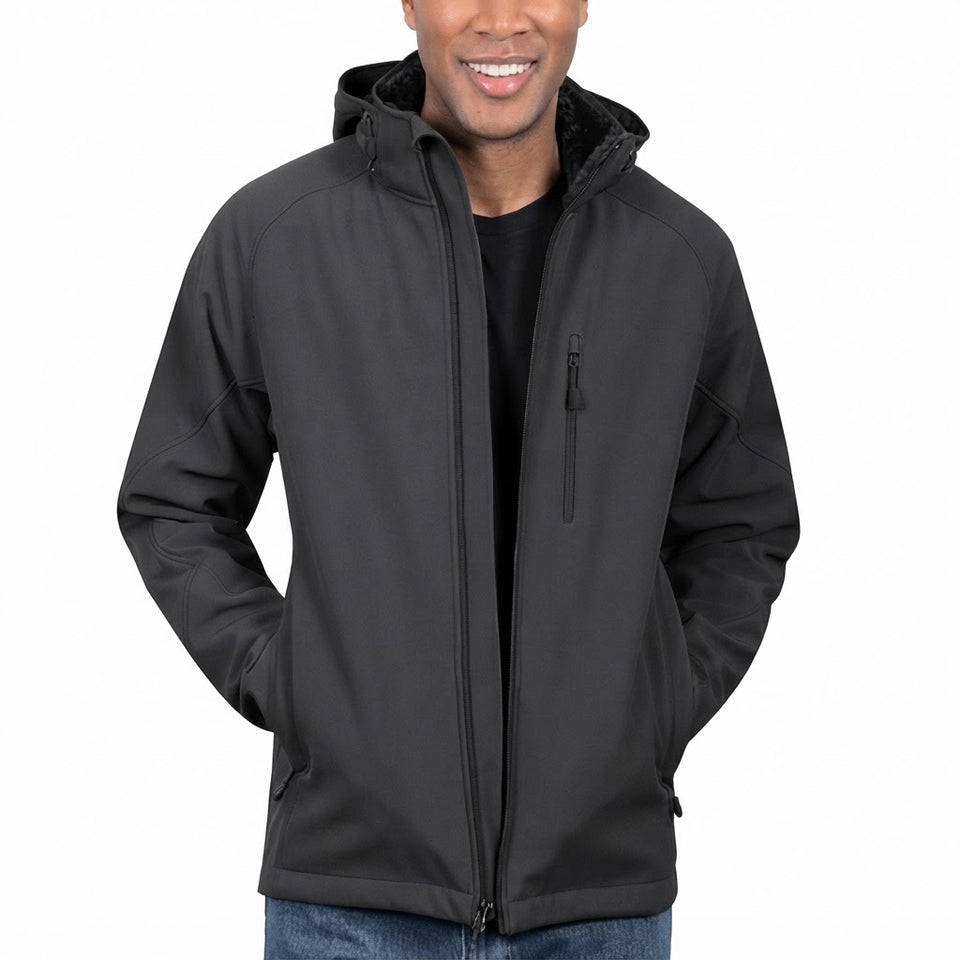 A man wearing a black hooded zip-up jacket over a black shirt and blue jeans, shown from the chest up against a plain white background.
