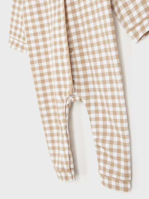 Beige and white checkered baby onesie on a light gray background