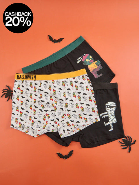 Three pairs of Halloween-themed boxer briefs on an orange background with decorative elements.