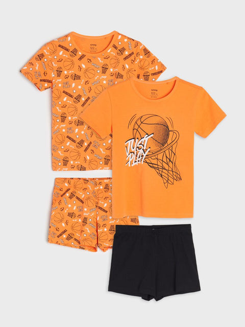 Orange t-shirt with basketball graphic and patterned shorts on a white background