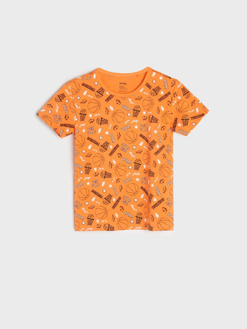 Orange t-shirt with dessert pattern on a light gray background