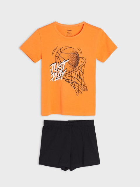 Orange t-shirt with basketball graphic and black shorts on a white background